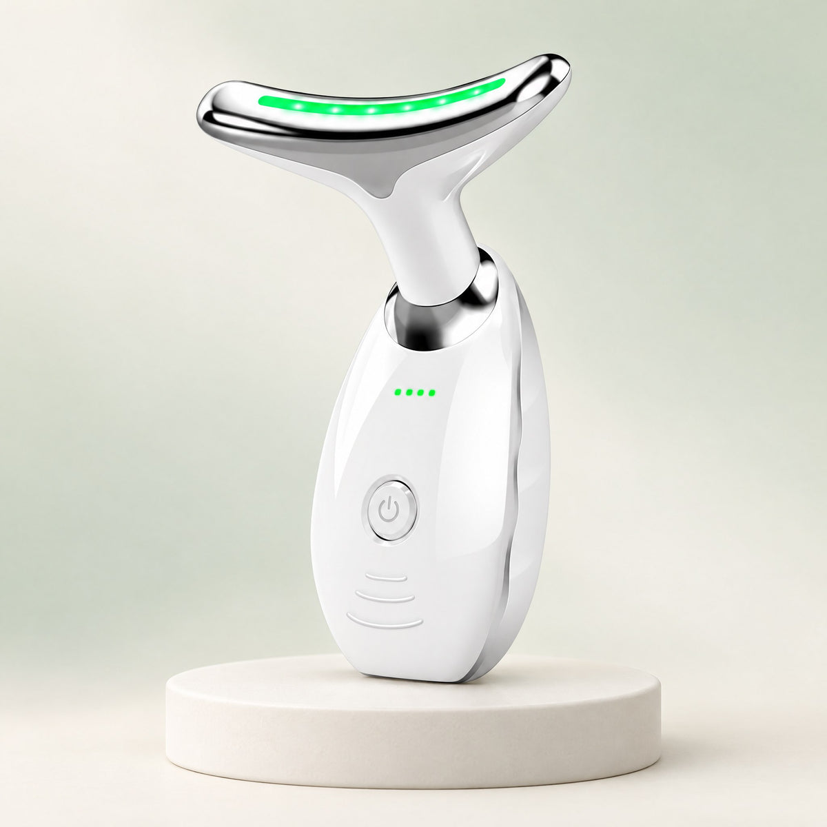 Masajeador de cuello Cisne blanco con luz LED verde encendida, sobre un pedestal claro